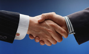 Image of two people shaking hands