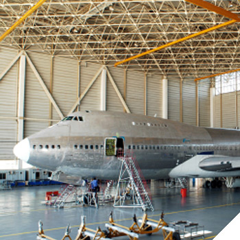 Image of an airplane undergoing maintenance in a hanger