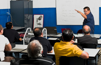 Image of an instructor and students in a classroom