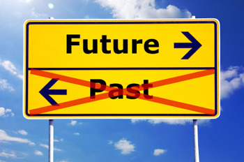 Image of a signpost pointing to the future and to the past but the past section has a cross going through it